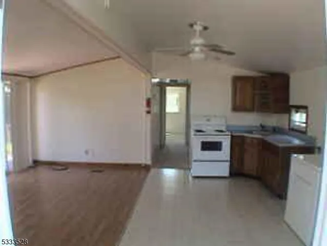 a kitchen with a refrigerator stove and oven