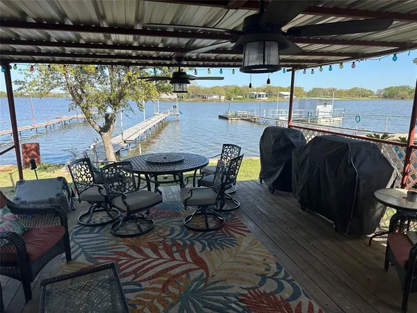 a view of a chairs and table in the patio
