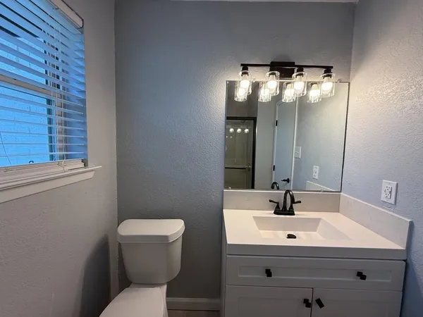 a view of walk in closet with wooden floor