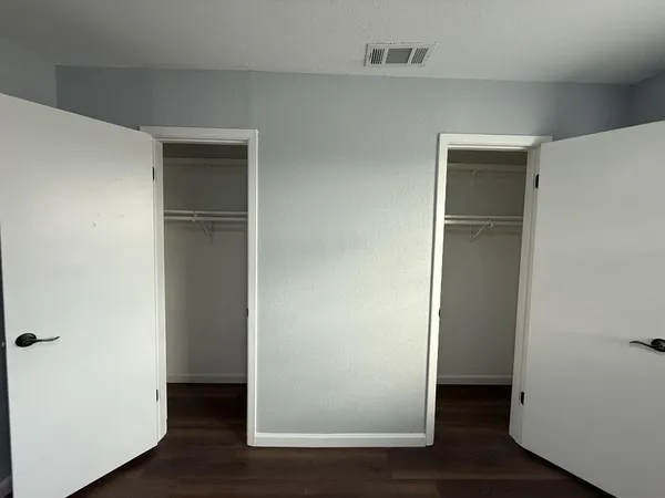 a bathroom with a sink and mirror with toilet