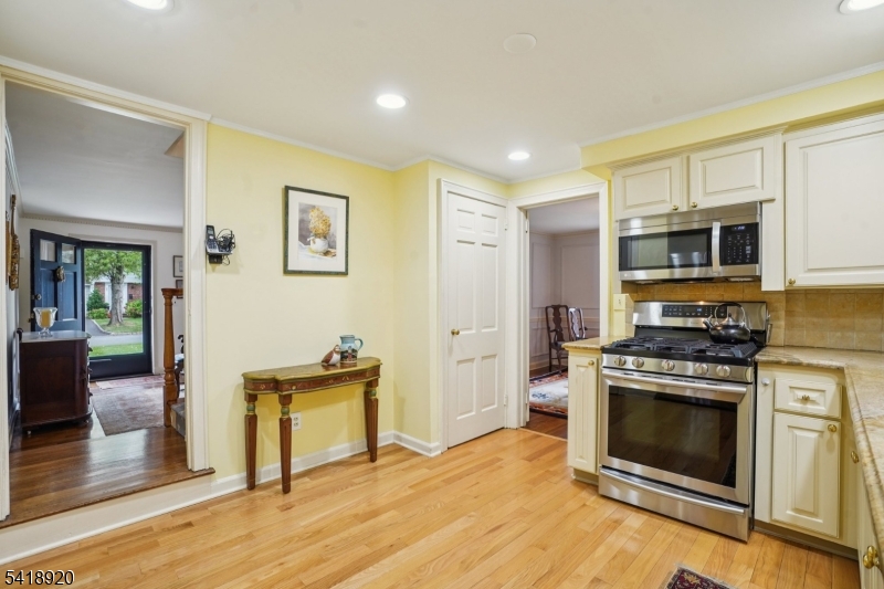 66 Springbrook Road Springfield, NJ 07081 - Photo 15 of 38 a kitchen with granite countertop a stove and a refrigerator