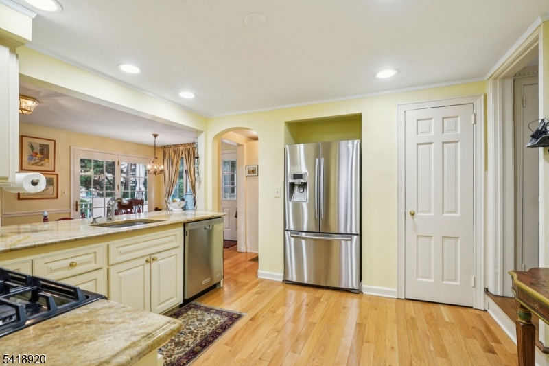 66 Springbrook Road Springfield, NJ 07081 - Photo 16 of 38 a kitchen with stainless steel appliances granite countertop a refrigerator and a sink