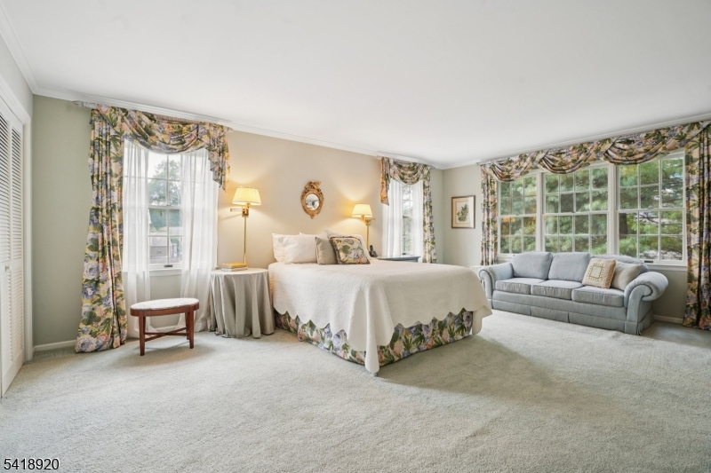 66 Springbrook Road Springfield, NJ 07081 - Photo 25 of 38 a bed sitting in a spacious bedroom next to a window