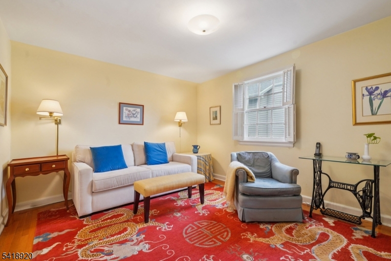 66 Springbrook Road Springfield, NJ 07081 - Photo 29 of 38 a living room with furniture and a window
