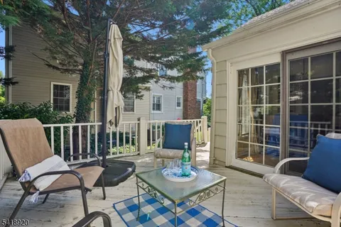 a view of a patio with a chairs and table in a patio