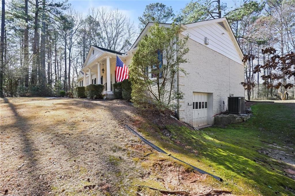4505 Cochran Mill Road Fairburn, GA 30213 - Photo 33 of 36 a view of a house with a yard
