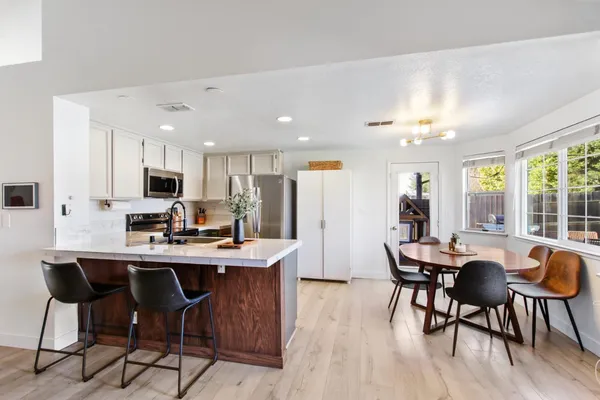 a view of a dining room with furniture window and outside view