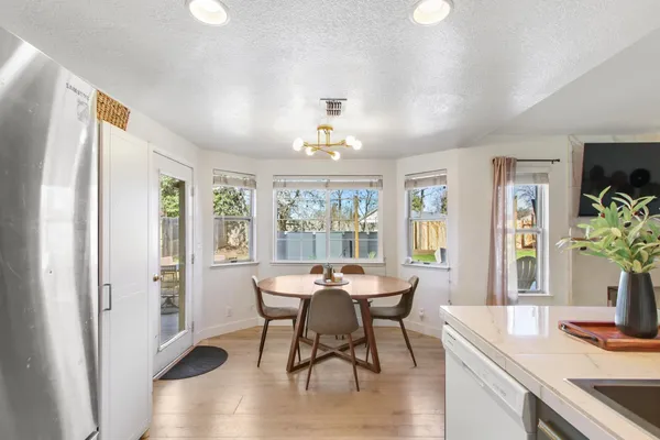 a view of a dining room with furniture window and outside view