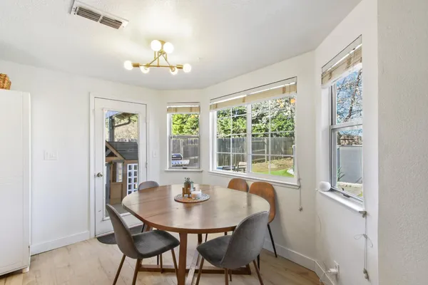 a view of a dining room with furniture window and outside view
