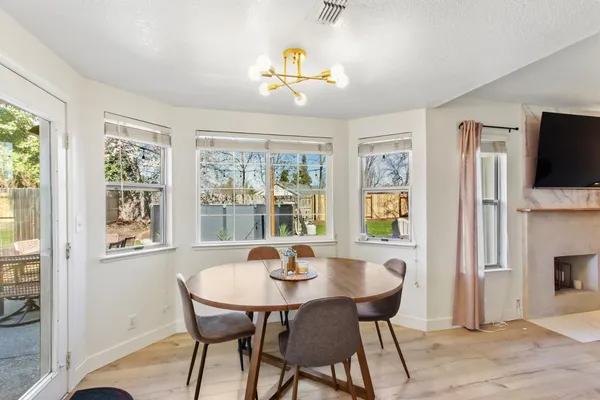 a view of a dining room with furniture window and outside view