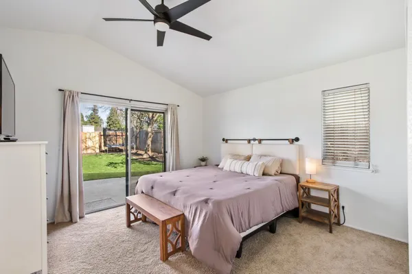 a bedroom with a bed and a table