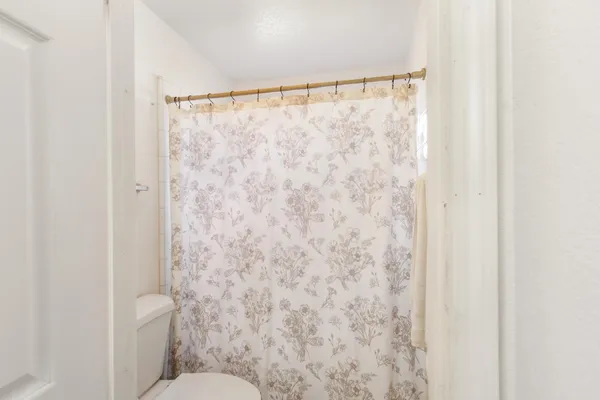 a bathroom with a shower curtain