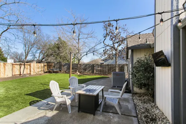 a view of a patio in back of a house