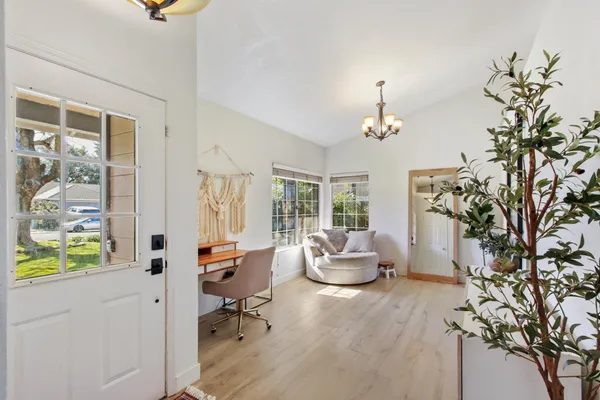 a living room with furniture and a window