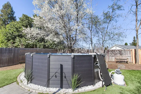 a view of a patio in backyard
