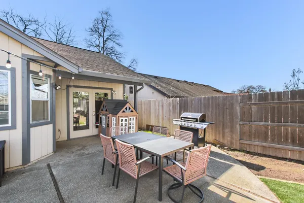 a view of a chairs and table in the patio