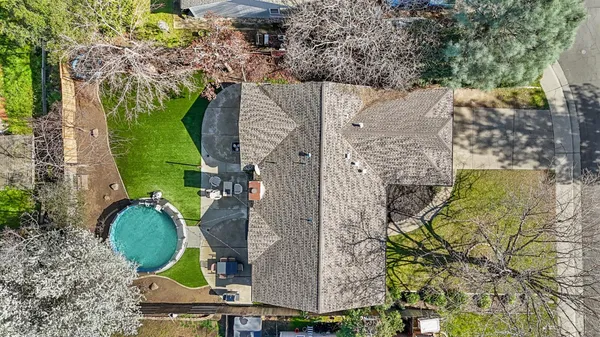 an aerial view of a house with outdoor space