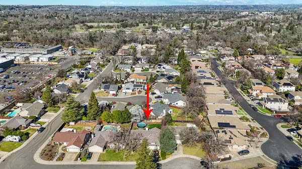 an aerial view of residential houses with outdoor space