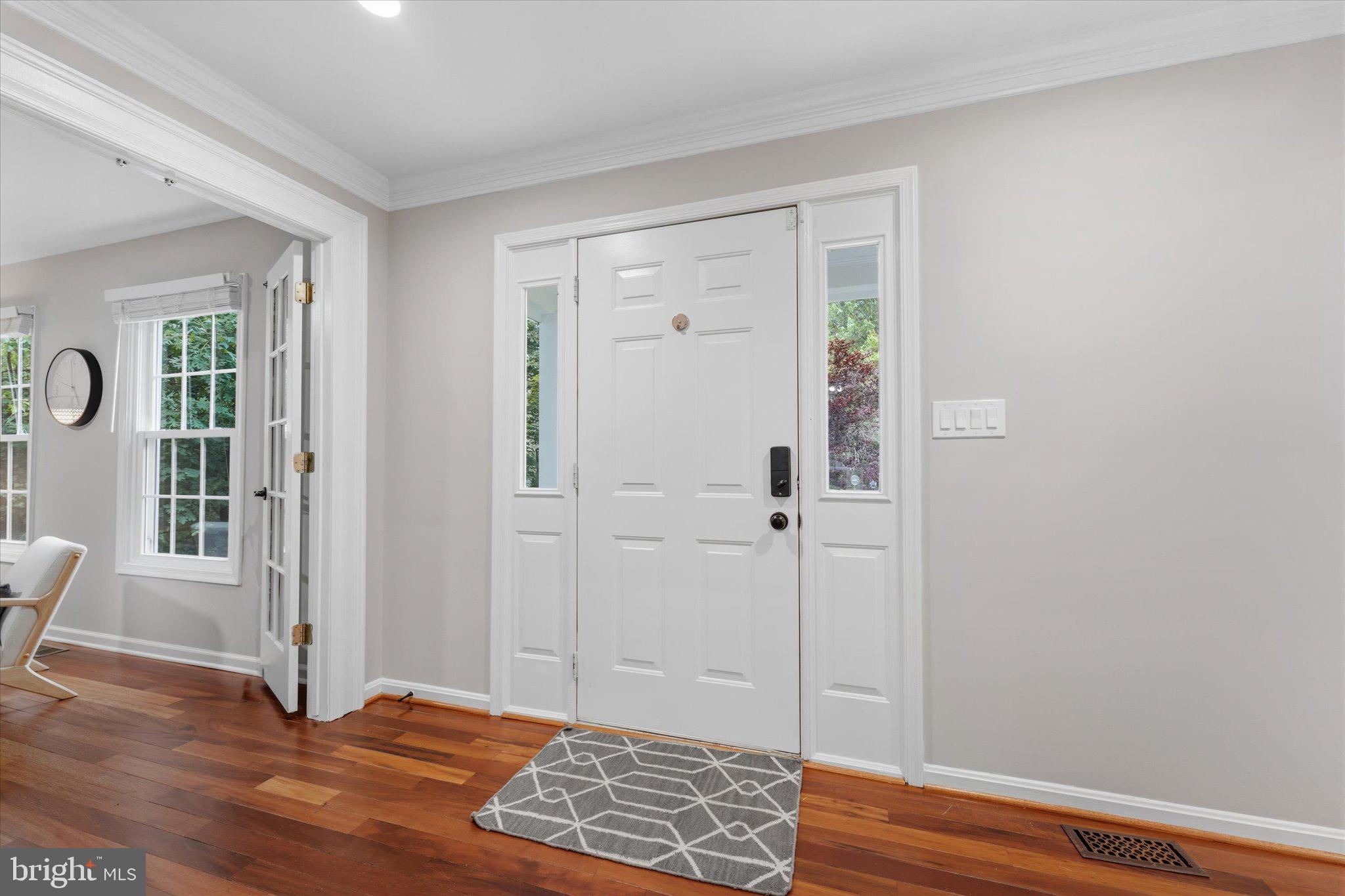 8047 Counselor Road Manassas, VA 20112 - Photo 5 of 55 Bright, inviting entry with refinished hardwood fl