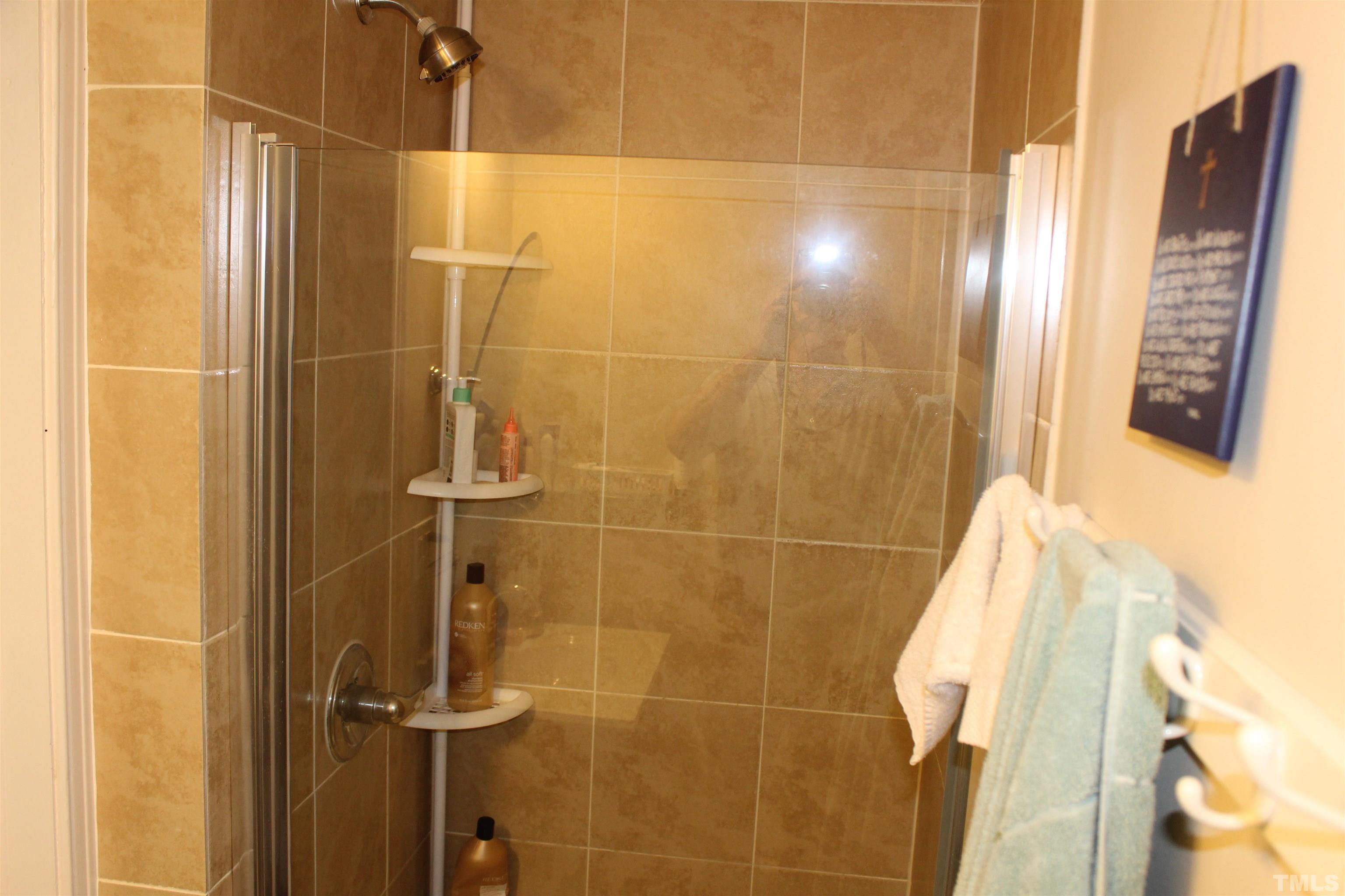 2248 The Circle, Unit 2 Raleigh, NC 27608 - Photo 11 of 21 a bathroom with a shower