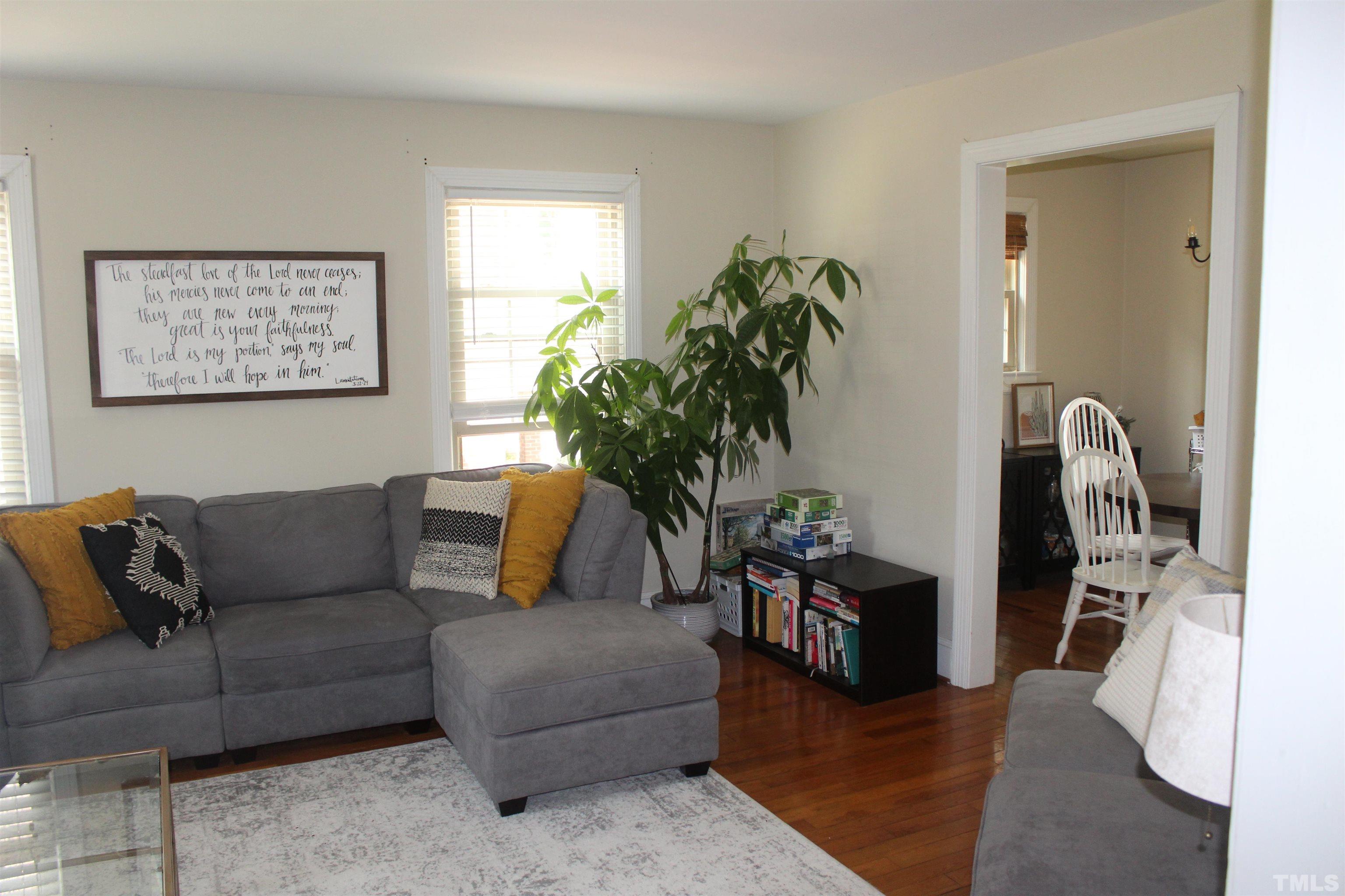 2248 The Circle, Unit 2 Raleigh, NC 27608 - Photo 5 of 21 a living room with furniture potted plant and a window