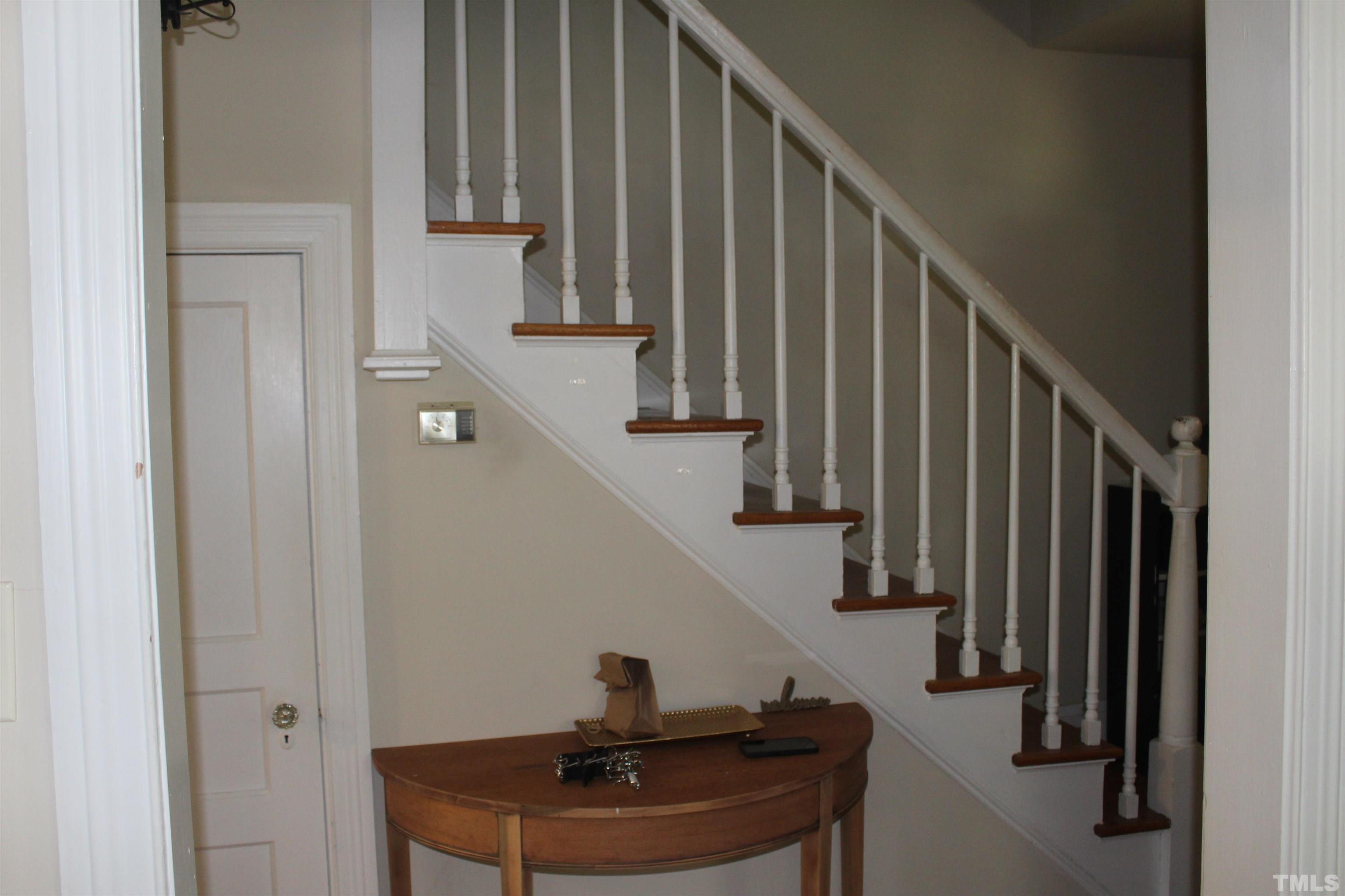 2248 The Circle, Unit 2 Raleigh, NC 27608 - Photo 9 of 21 a view of entryway and hall with wooden floor