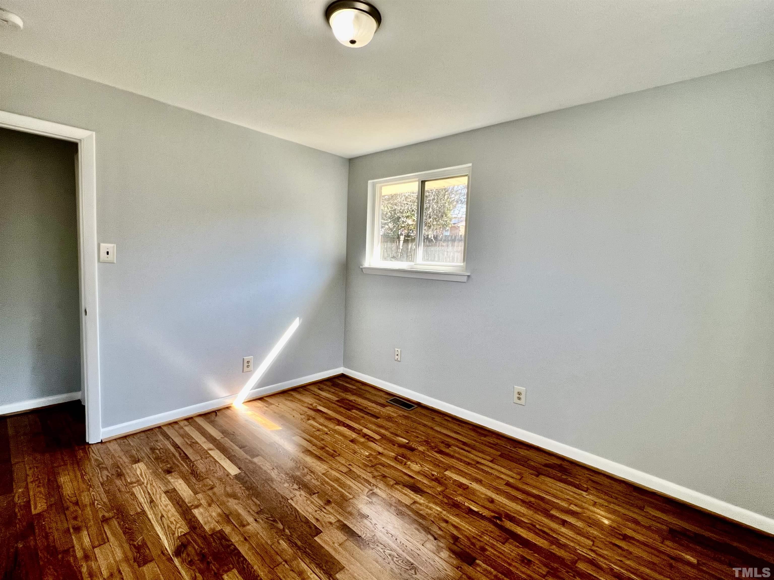 828 Newcombe Road Raleigh, NC 27610 - Photo 23 of 24 a view of a room with wooden floor