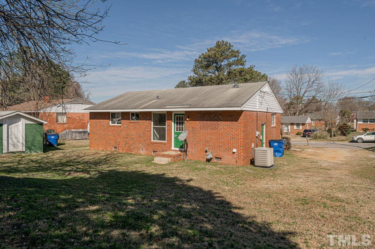 828 Newcombe Road Raleigh, NC 27610 - Photo 6 of 24 a view of a house with a yard
