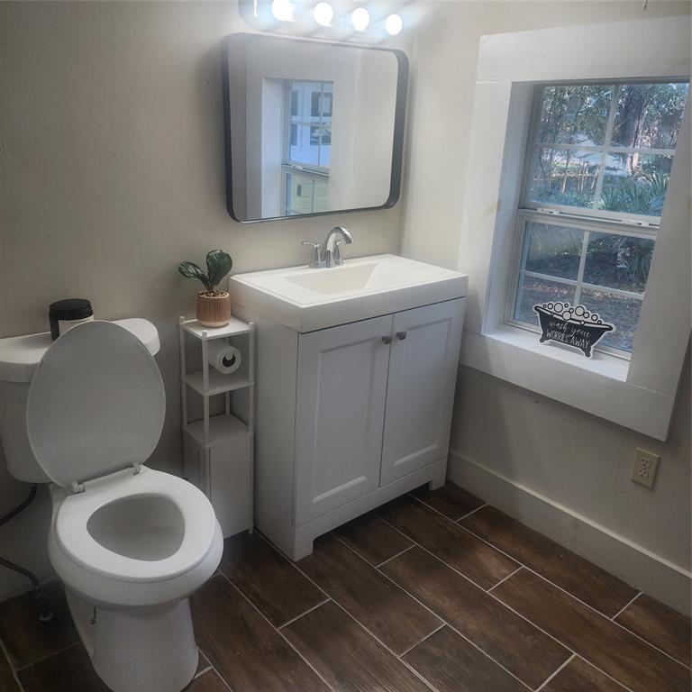 827 East Carroll Street Coushatta, LA 71019 - Photo 9 of 10 a bathroom with a toilet sink and mirror