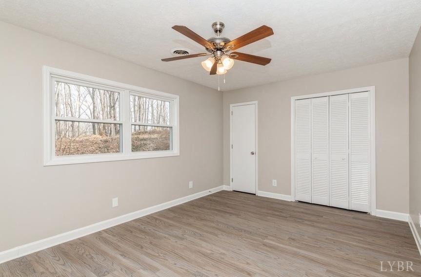 1180 David Giles Lane Blairs, VA 24527 - Photo 18 of 34 a view of an empty room with wooden floor and a window