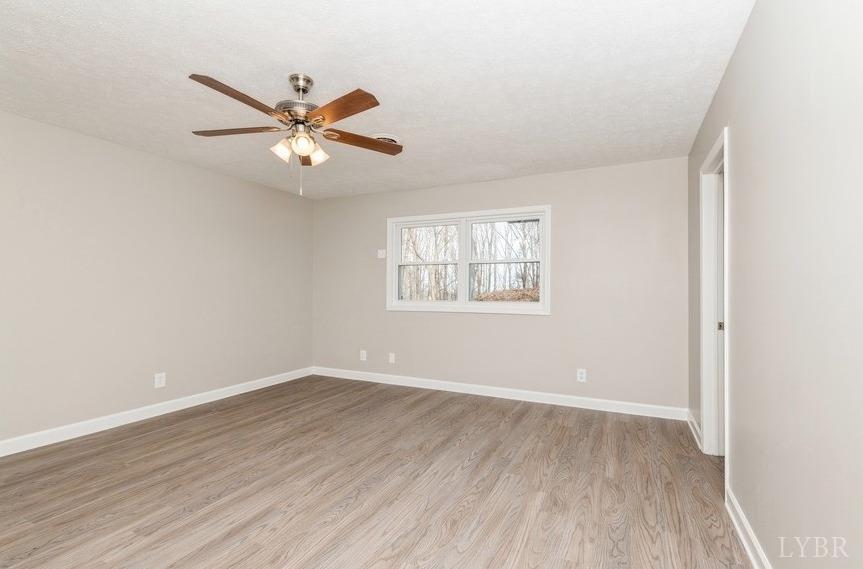 1180 David Giles Lane Blairs, VA 24527 - Photo 20 of 34 wooden floor in an empty room with a window
