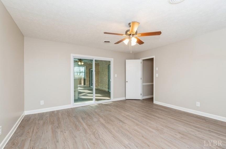 1180 David Giles Lane Blairs, VA 24527 - Photo 21 of 34 an empty room with wooden floor and windows