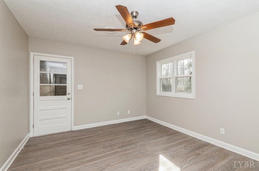 1180 David Giles Lane Blairs, VA 24527 - Photo 27 of 34 an empty room with wooden floor closet and windows