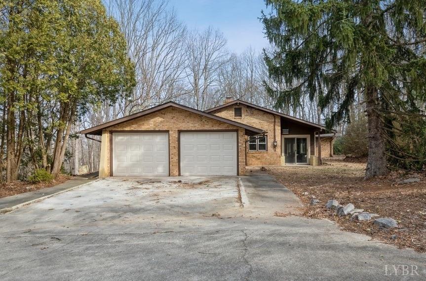 1180 David Giles Lane Blairs, VA 24527 - Photo 5 of 34 a front view of house with yard and trees all around