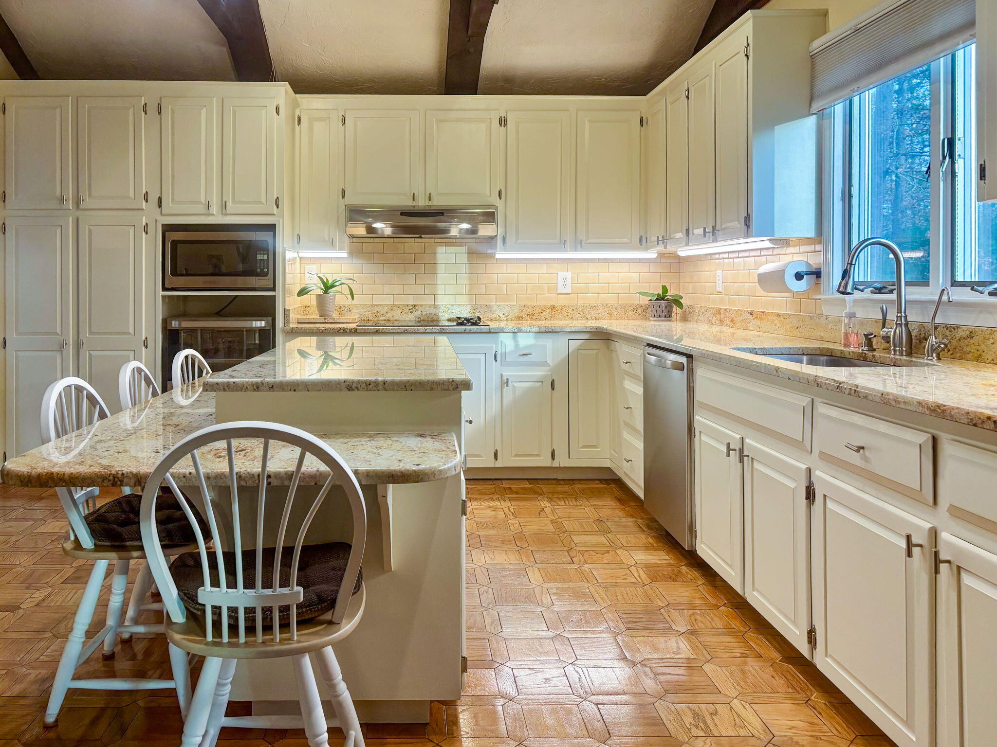 28 Brook Street Plympton, MA 02367 - Photo 24 of 57 a kitchen with stainless steel appliances a stove a sink cabinets and a dining table