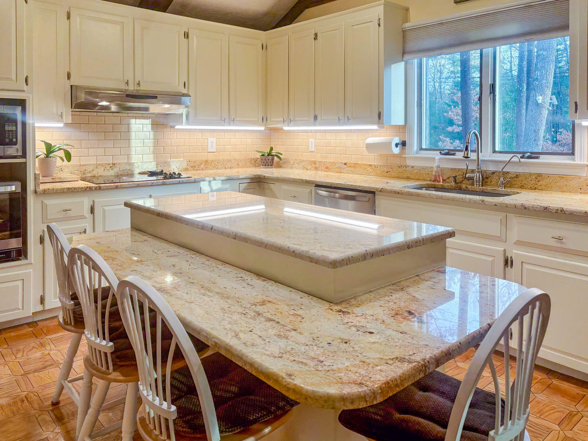 28 Brook Street Plympton, MA 02367 - Photo 27 of 57 a kitchen with stainless steel appliances granite countertop a sink and a white cabinets