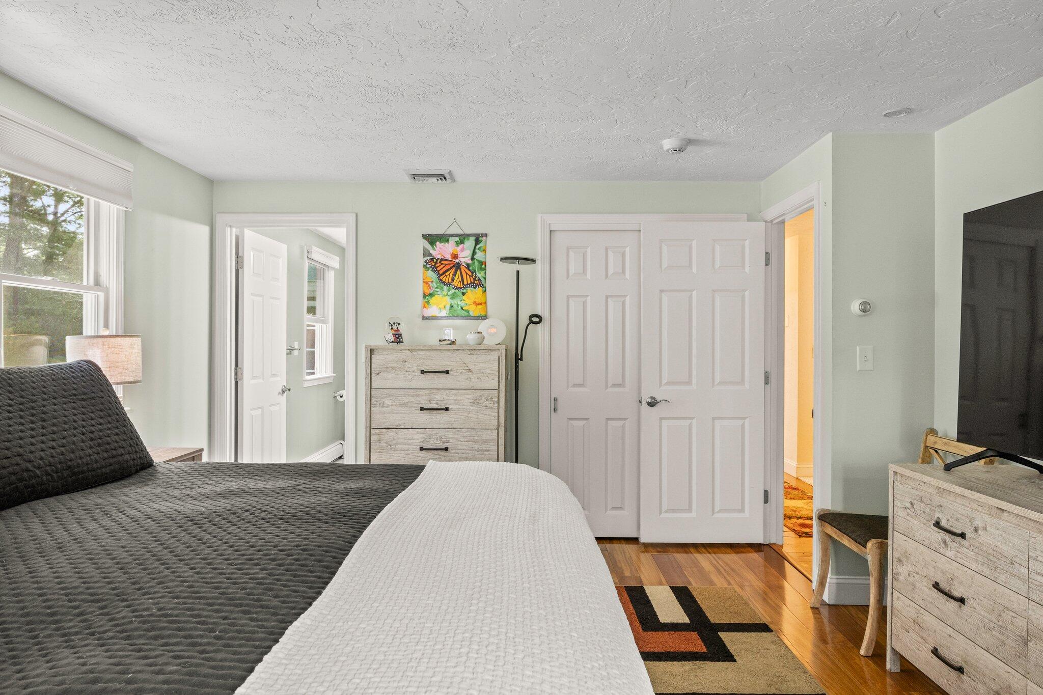 28 Brook Street Plympton, MA 02367 - Photo 31 of 57 a bedroom with a bed and flat tv screen on dresser