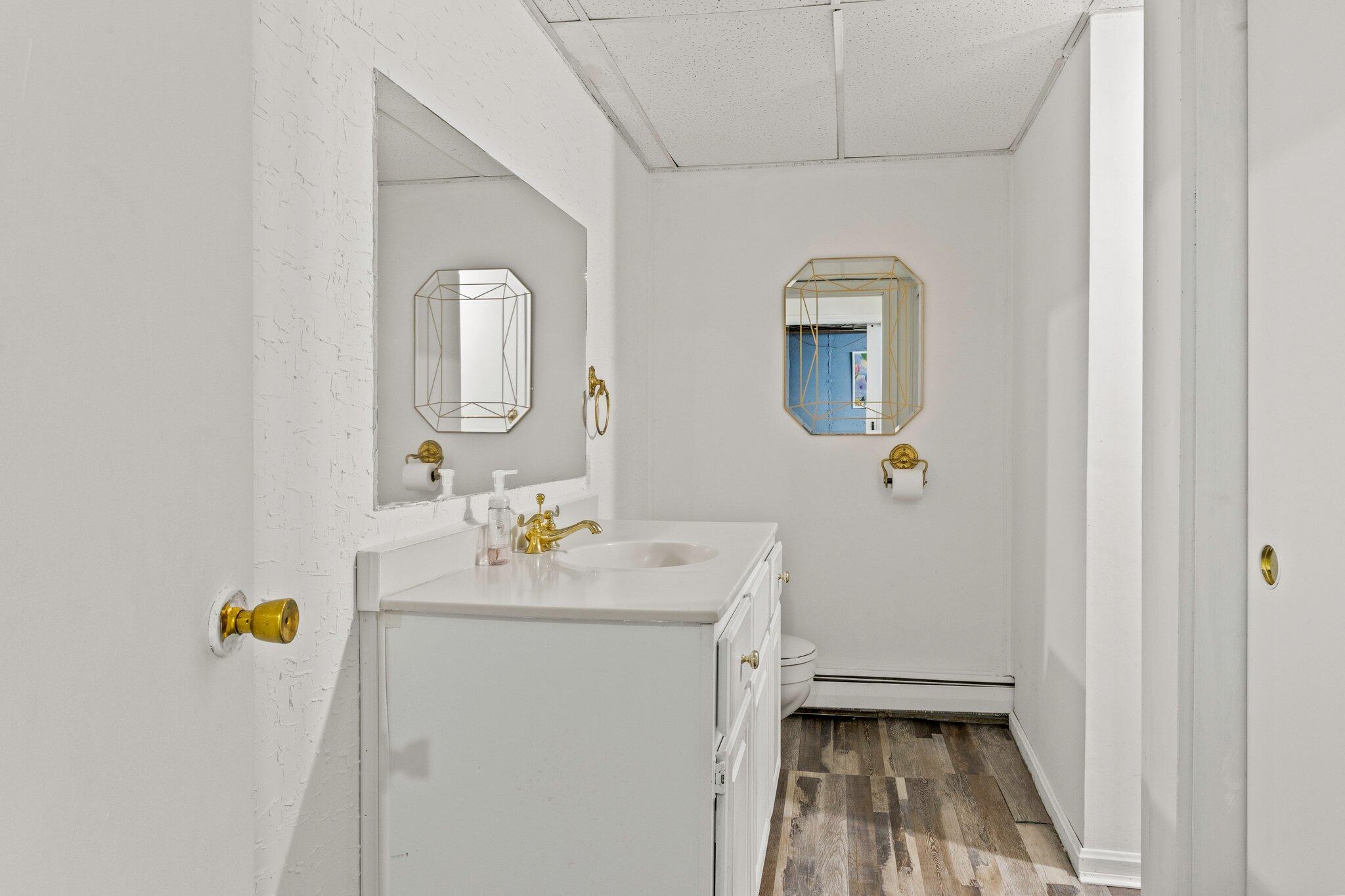 28 Brook Street Plympton, MA 02367 - Photo 46 of 57 a bathroom with a sink a toilet and mirror