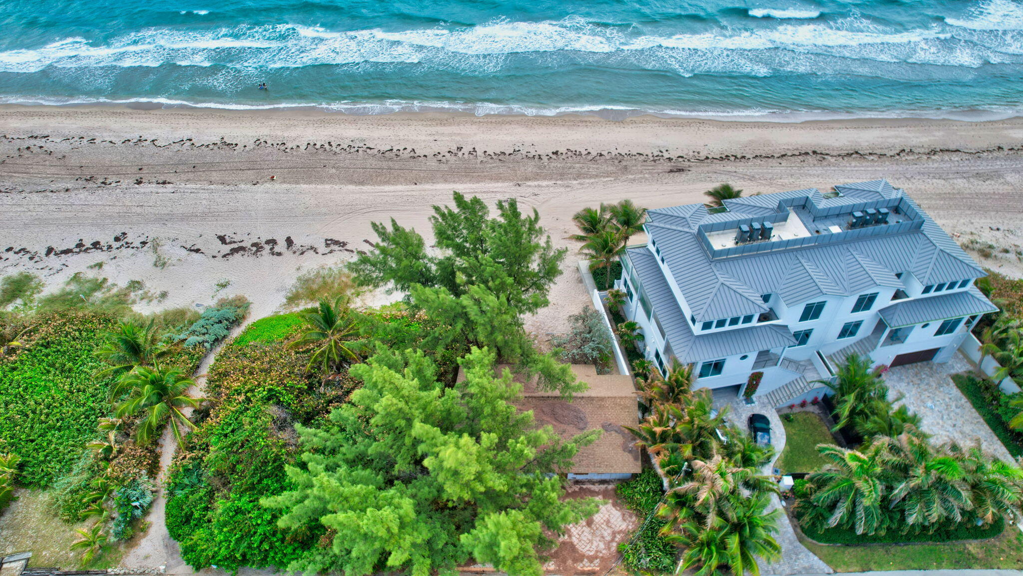 5015 Old Ocean Boulevard Ocean Ridge, FL 33435 - Photo 1 of 45 an aerial view of a house with a yard