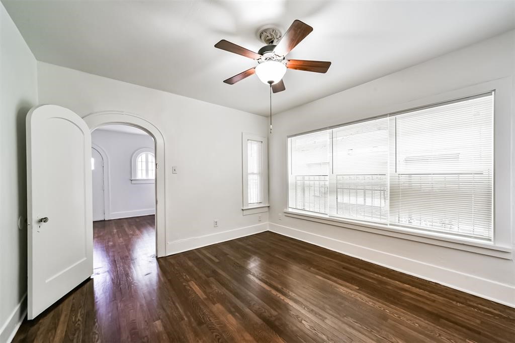 2235 Welch Street Houston, TX 77019 - Photo 12 of 18 a view of entryway and hall with wooden floor