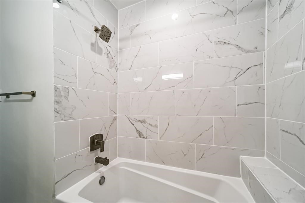 2235 Welch Street Houston, TX 77019 - Photo 17 of 18 a bathroom with a bathtub