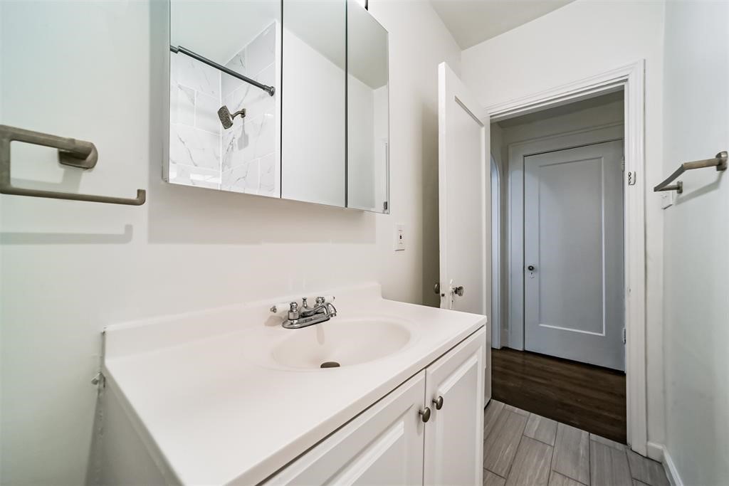2235 Welch Street Houston, TX 77019 - Photo 18 of 18 a bathroom with a sink and a mirror