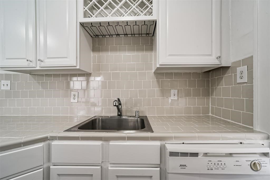 2235 Welch Street Houston, TX 77019 - Photo 9 of 18 a kitchen with a sink and cabinets