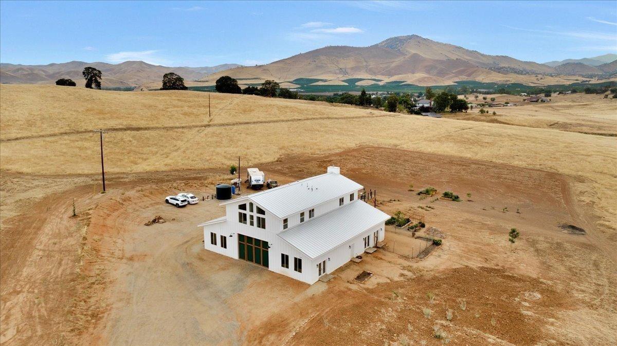 22654 Cobblestone Lane Sanger, CA 93657 - Photo 11 of 64 a view of a lake with a mountain