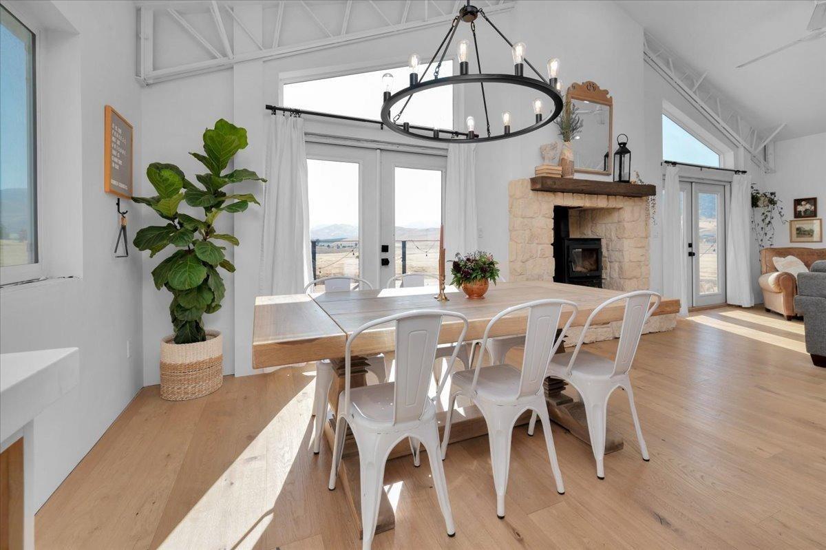22654 Cobblestone Lane Sanger, CA 93657 - Photo 18 of 64 a view of a dining room with furniture a chandelier and wooden floor