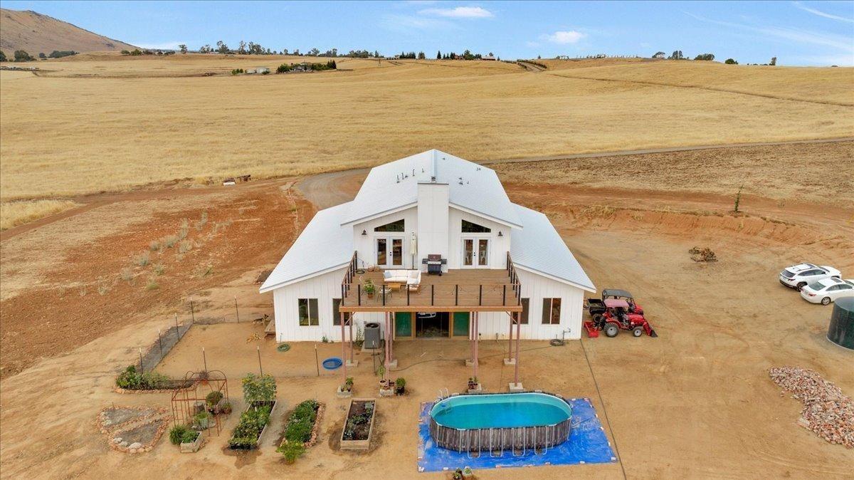 22654 Cobblestone Lane Sanger, CA 93657 - Photo 2 of 64 a aerial view of a house with a terrace