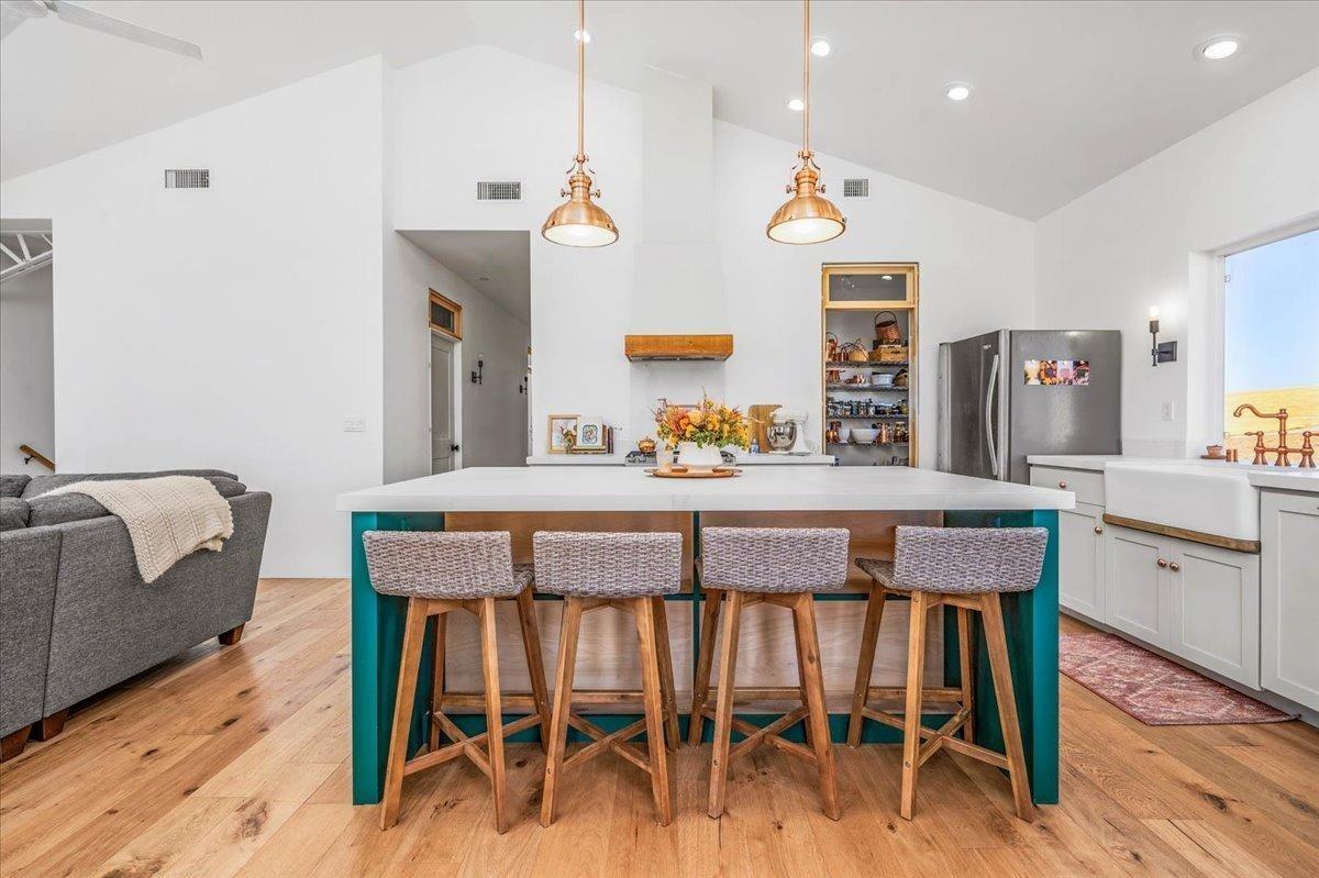 22654 Cobblestone Lane Sanger, CA 93657 - Photo 21 of 64 a dining room with furniture and wooden floor