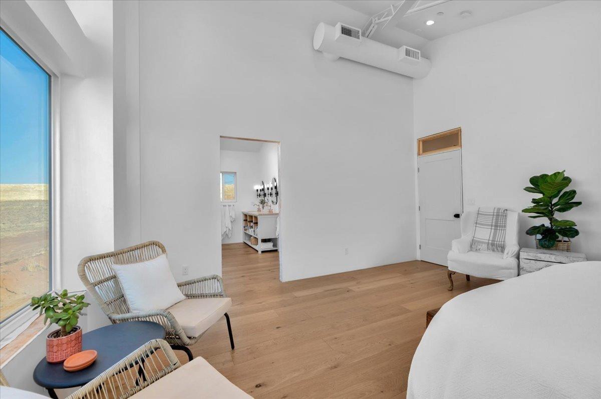 22654 Cobblestone Lane Sanger, CA 93657 - Photo 30 of 64 a bedroom with furniture and a potted plant