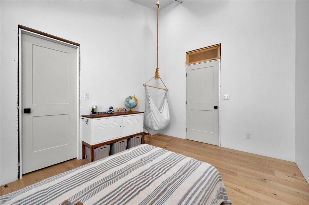 22654 Cobblestone Lane Sanger, CA 93657 - Photo 36 of 64 a room with a bed and a mirror