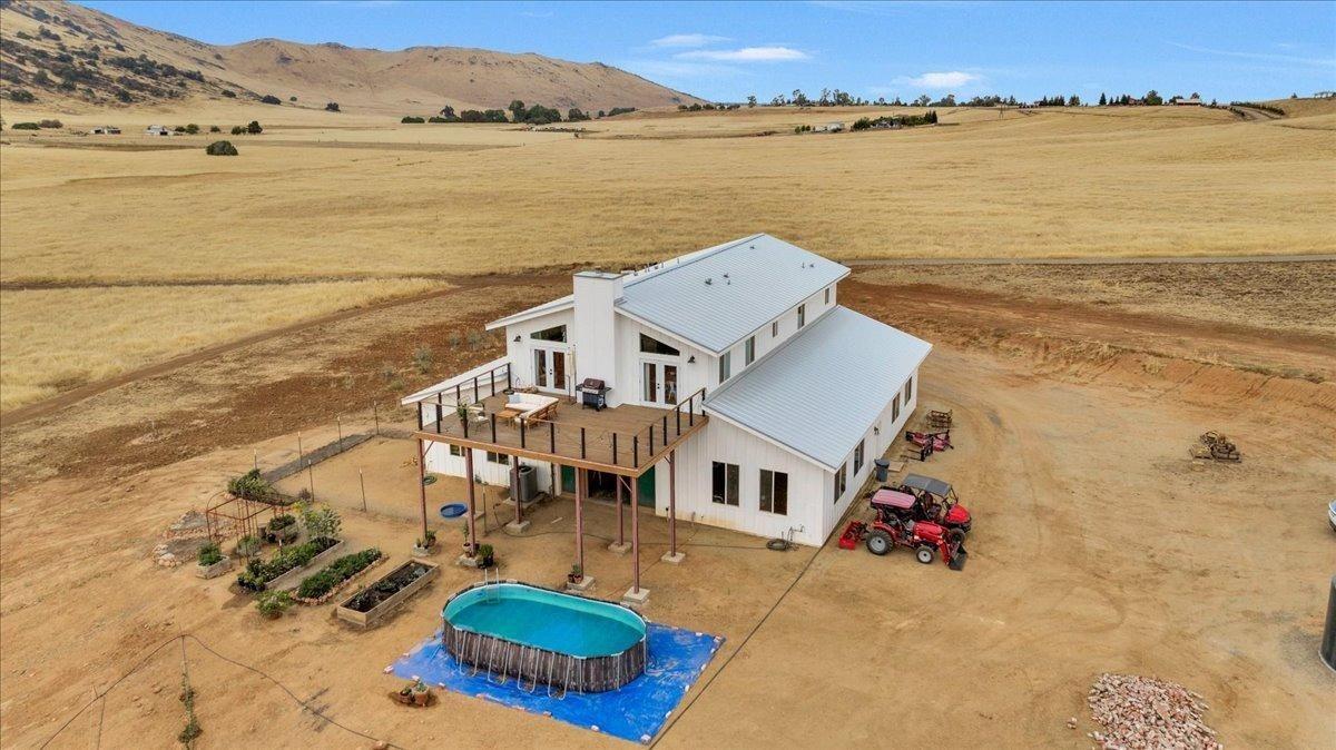 22654 Cobblestone Lane Sanger, CA 93657 - Photo 4 of 64 a view of a lake with a mountain